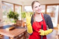 Beautiful wife cleaning the house cheerfully