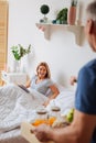 Beautiful wife feeling grateful for the breakfast in bed