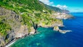 Beautiful wild coast scenery view with Bridal Veil Falls (Veu da noiva) at Ponta do Poiso in Madeira Island. Aerial view