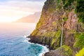 Beautiful wild coast scenery view with Bridal Veil Falls (Veu da noiva) at Ponta do Poiso in Madeira Island. Near Porto Moniz,