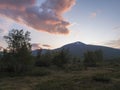 Beautiful wild Lapland nature landscape with birch tree forest and mountain Sanjartjakka. Sweden north landscape in summer, sunset Royalty Free Stock Photo