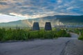 Beautiful and wild tundra of the Arctic in Russia and industrial plant. Works throw their waste into the atmosphere