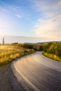 Beautiful winding country road leading through rural countryside Royalty Free Stock Photo