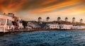 The windmills above Mykonos town during sunset time, Greece Royalty Free Stock Photo