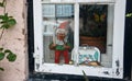 Beautiful window with figures in the street of old town, Lubeck, Germany Royalty Free Stock Photo