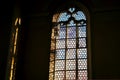 Beautiful window and a lamp in the german catholic church. Light and shadow