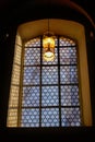 Beautiful window and a lamp in the german catholic church Royalty Free Stock Photo