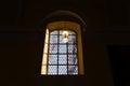 Beautiful window and a lamp in the german catholic church. Light and shadow Royalty Free Stock Photo