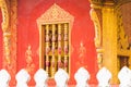 Beautiful window in the temple Wat Sensoukaram in Louangphabang, Laos. Close-up.