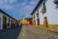 Beautiful windows and stone street with people from antigua guatemala city