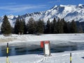 Beautiful winter atmosphere on storage lake Valos or reservoir lake Valos (Speichersee Valos)