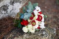 Beautiful winter bouquet of spruce, roses and cotton. The bride`s bouquet.