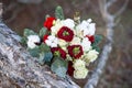 Beautiful winter bouquet of spruce, roses and cotton. The bride`s bouquet.