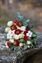 Beautiful winter bouquet of spruce, roses and cotton. The bride`s bouquet.