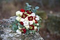 Beautiful winter bouquet of spruce, roses and cotton. The bride`s bouquet.