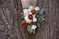 Beautiful winter bouquet of spruce, roses and cotton. The bride`s bouquet.