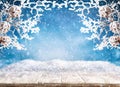 Beautiful winter or Christmas background with wooden old desk and snowy frosted branches and pine cones Royalty Free Stock Photo