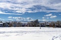 Snow covered Park with cross-country skier in Denver, Colorado Royalty Free Stock Photo