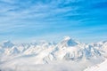beautiful winter day landscape with snow covered peaks of Caucasus mountain, Dombaj over clouds, Russia, close up Royalty Free Stock Photo