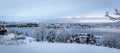 Beautiful winter day at Odderoya in Kristiansand, Norway. Trees covered in snow. The ocean and archipelago in the Royalty Free Stock Photo