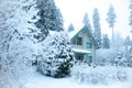 Beautiful winter forest and snow-covered house. Royalty Free Stock Photo