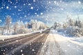 Winter landscape with asphalt road,forest and blue sky. Royalty Free Stock Photo
