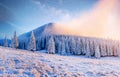 Beautiful winter landscape in the Carpathian mountains. Vibrant night sky with stars and nebula and galaxy. Deep sky Royalty Free Stock Photo