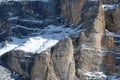 Beautiful winter landscape in the Cortina d`Ampezzo Dolomites. Skiers in front of Tofana di Rozes and the Cinque Torri group.