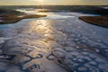 Beautiful winter landscape - drone aerial photo sunset time - frozen Wigry lake, forest and sun reflections