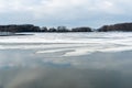 Beautiful winter landscape forest on the lake shore on a sunny frosty day. Panorama of the coastline covered with snow and birch Royalty Free Stock Photo