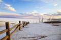 Beautiful winter landscape. Frozen Lake Baikal, the surface of the ice in the snow. Olkhon Island Royalty Free Stock Photo