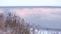 Beautiful winter landscape frozen lake Ice and snow the reflection on the water