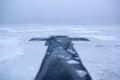 Beautiful winter landscape with Ice Cross on frozen river on foggy morning III Royalty Free Stock Photo