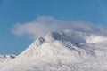 Beautiful Winter landscape image looking towards Scottish Highlands mountain range across Loch Ba on Rannoch Moor Royalty Free Stock Photo