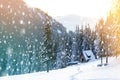 Beautiful winter landscape in the mountains with falling snow an Royalty Free Stock Photo