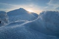 Beautiful winter landscape in mountains on sunny, bright day, with trees covered with huge amount of snow with amazing shapes Royalty Free Stock Photo