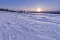 Beautiful winter landscape in mountains. View of snow-covered conifer trees and snowflakes at sunrise. Merry Christmas and happy. Royalty Free Stock Photo