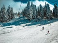 People having a good time on the slopes on a sunny day. Royalty Free Stock Photo