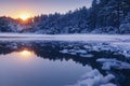 Beautiful Winter Landscape with Pine Forest and Sunset Reflections in a Lake full of Ice Pack Royalty Free Stock Photo