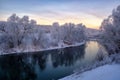 Beautiful winter landscape. river with snow-covered banks in the morning at dawn Royalty Free Stock Photo