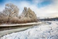 Beautiful Winter landscape scene background with snow covered trees and ice river Royalty Free Stock Photo