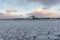 Beautiful winter landscape with ship in cargo port fuel terminal at sunset time., Ventspils, Latvia Royalty Free Stock Photo