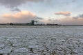 Beautiful winter landscape with ship in cargo port fuel terminal at sunset time., Ventspils, Latvia Royalty Free Stock Photo