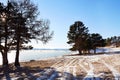 Beautiful winter landscape, the shore of frozen Lake Baikal on a sunny January day.