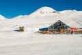 Beautiful winter landscape on skiing resort with ski lodge. White snow cover. Tourism industry. Negative space for text. Extreme s