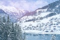 Beautiful winter landscape, snow-covered fluffy fir trees, snowfall in the mountains, panorama of mountain peaks, the Swiss Alps Royalty Free Stock Photo