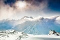 Beautiful winter landscape with snow-covered mountains at sunset Royalty Free Stock Photo