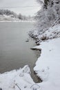 Beautiful winter landscape with snow-covered trees and flowing river. Snow forest and Winter background. Fabulous winter. Concept