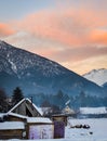 Beautiful winter landscape sunset with snow and village wooden houses Royalty Free Stock Photo