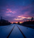 A beautiful winter landscape with train tracks during sunset. Royalty Free Stock Photo